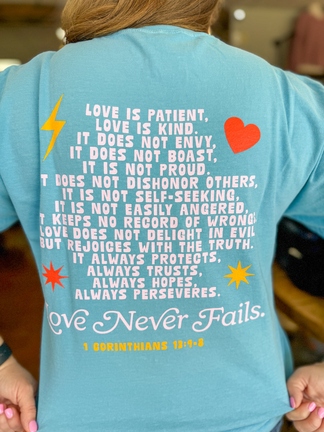 Love Never Fails Comfort Colors Tee